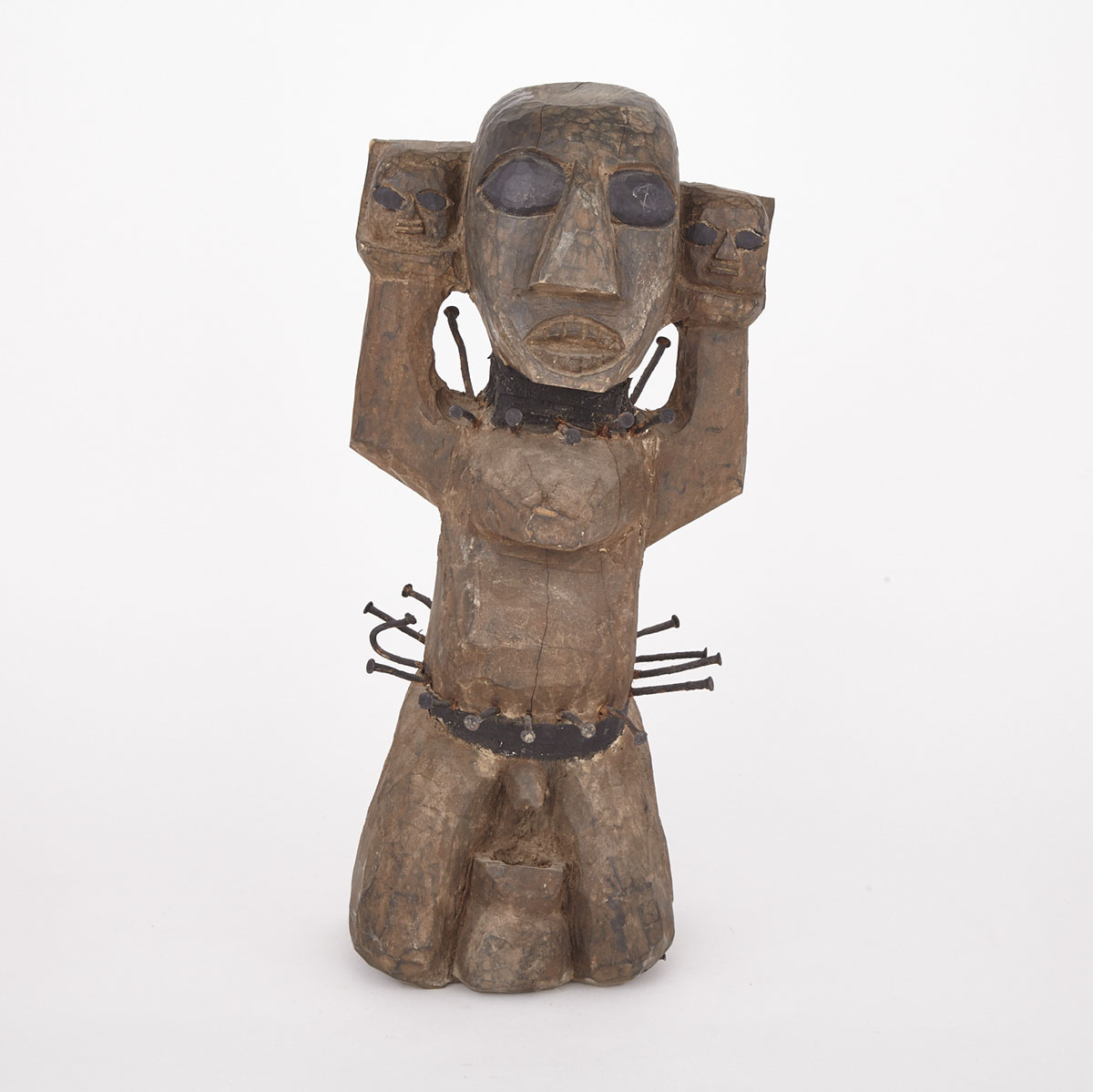 Carved Wood and Painted Fetish Figure with nail decorated waist and collar, Africa, 20th century
