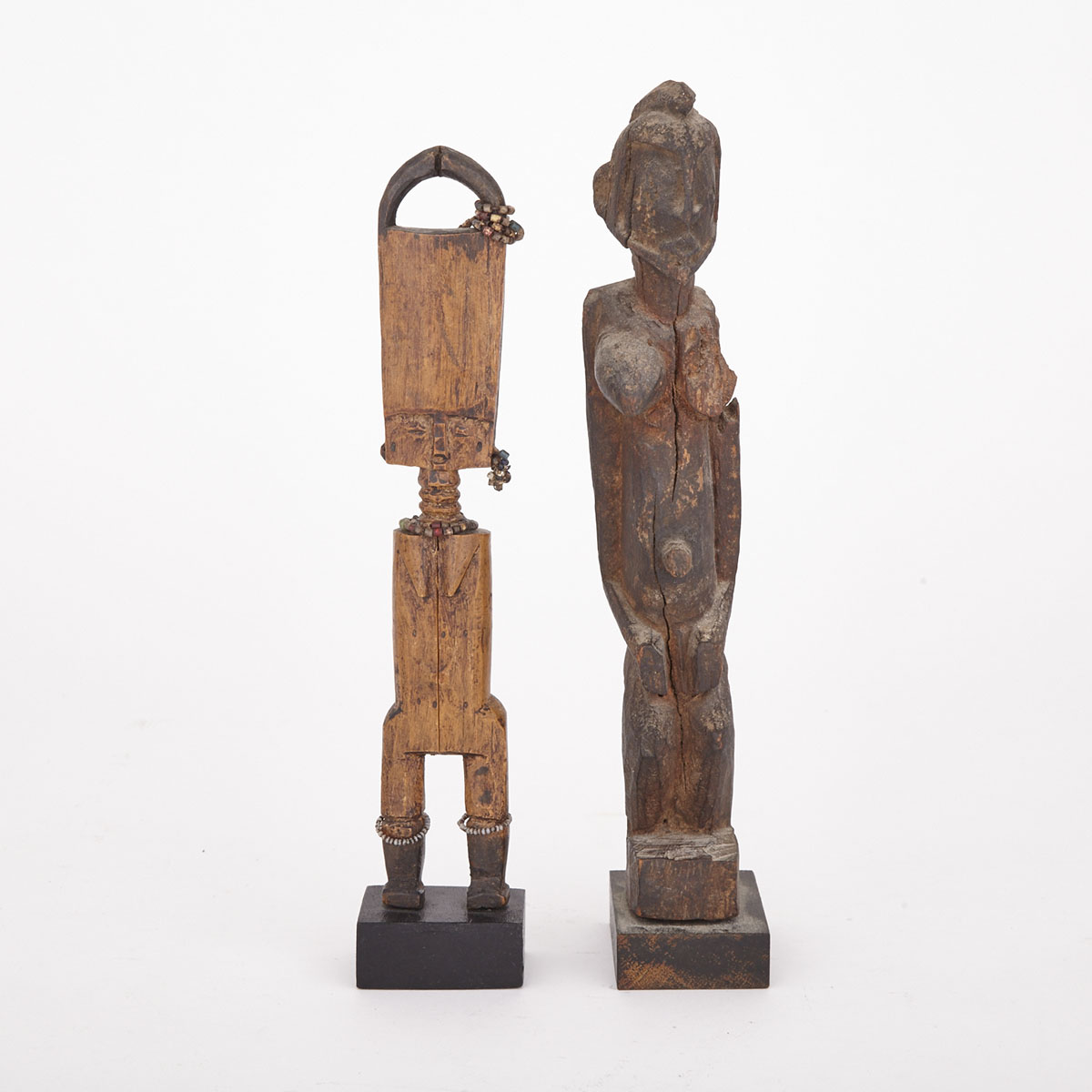 Fante Carved Wood Akuaba (Fertility) Doll with beaded decoration, West Africa, 20th century together with a Carved Wood Female Ancestral Figure, Africa, 20th century