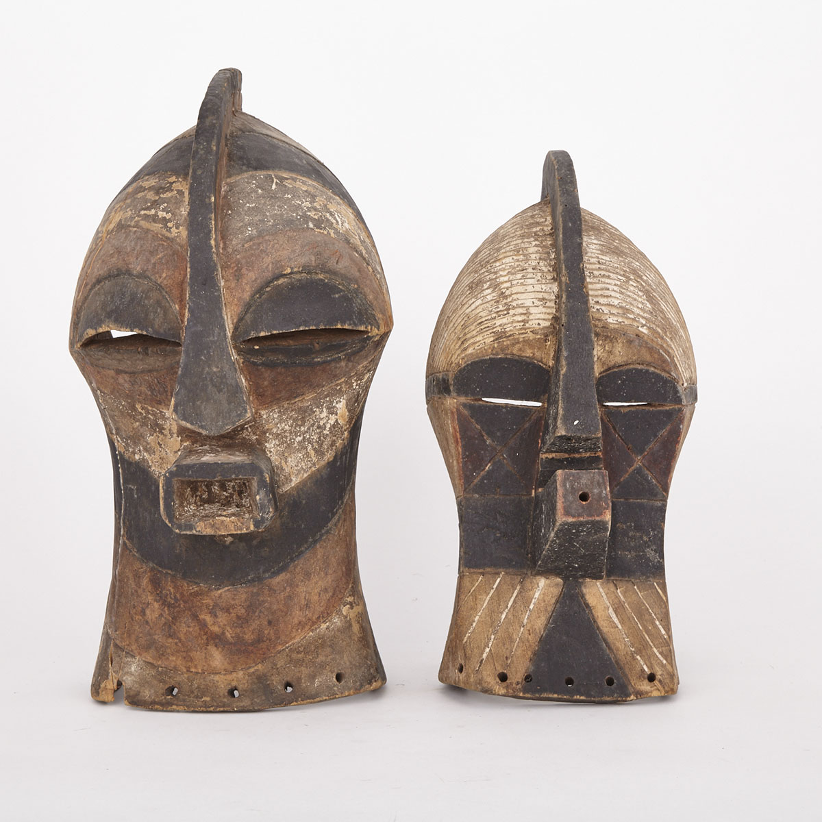 Two Songye Kifwebe Carved and Painted Wood Masks, Central Africa, 20th century