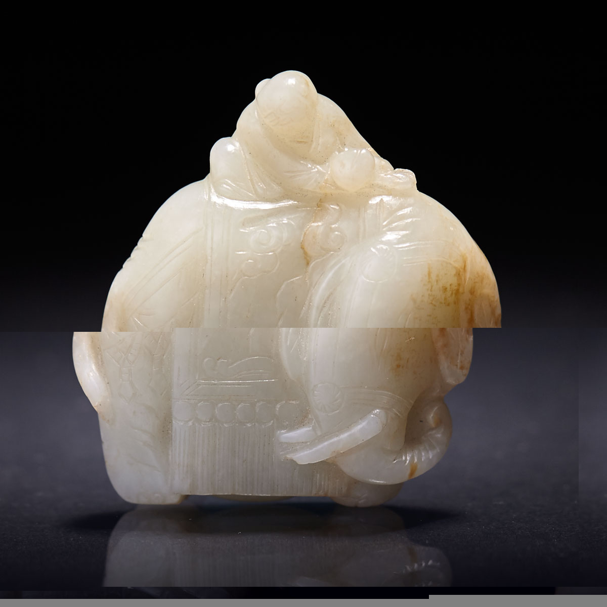 A Celadon White Jade 'Elephant and Boy' Carving, Qing Dynasty, 18th Century or Earlier