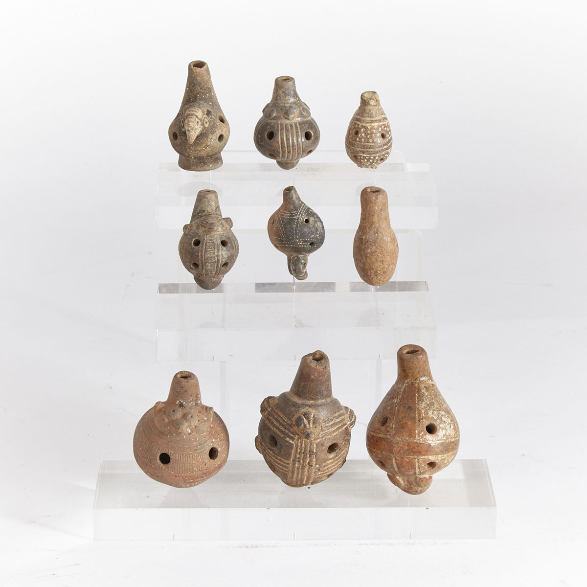 Group of Nine Guanacaste Animal Form Ocarinas and a Whistle, Classic Period, 300 B.C. - 300 A.D.