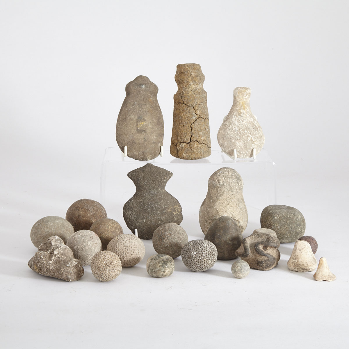 Group of Twenty Three Stone and Fossilized Coral Spheres, Tools and Fragments 