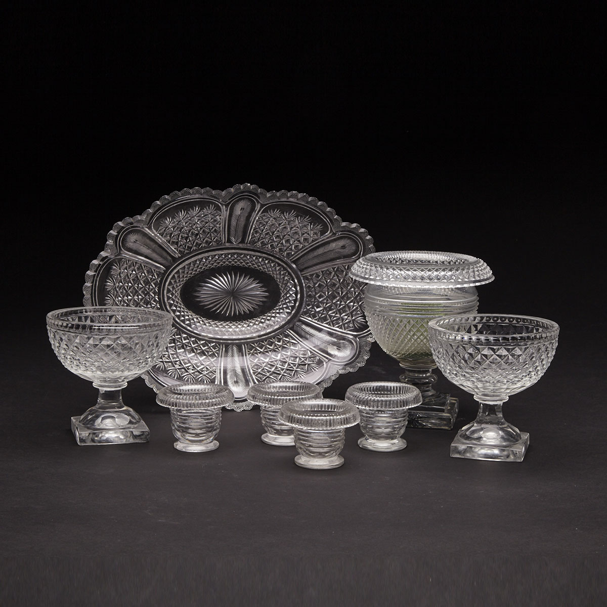 Anglo-Irish Cut Glass Oval Bowl, Two Footed Bowls, Four Salts and a Vase, 19th century