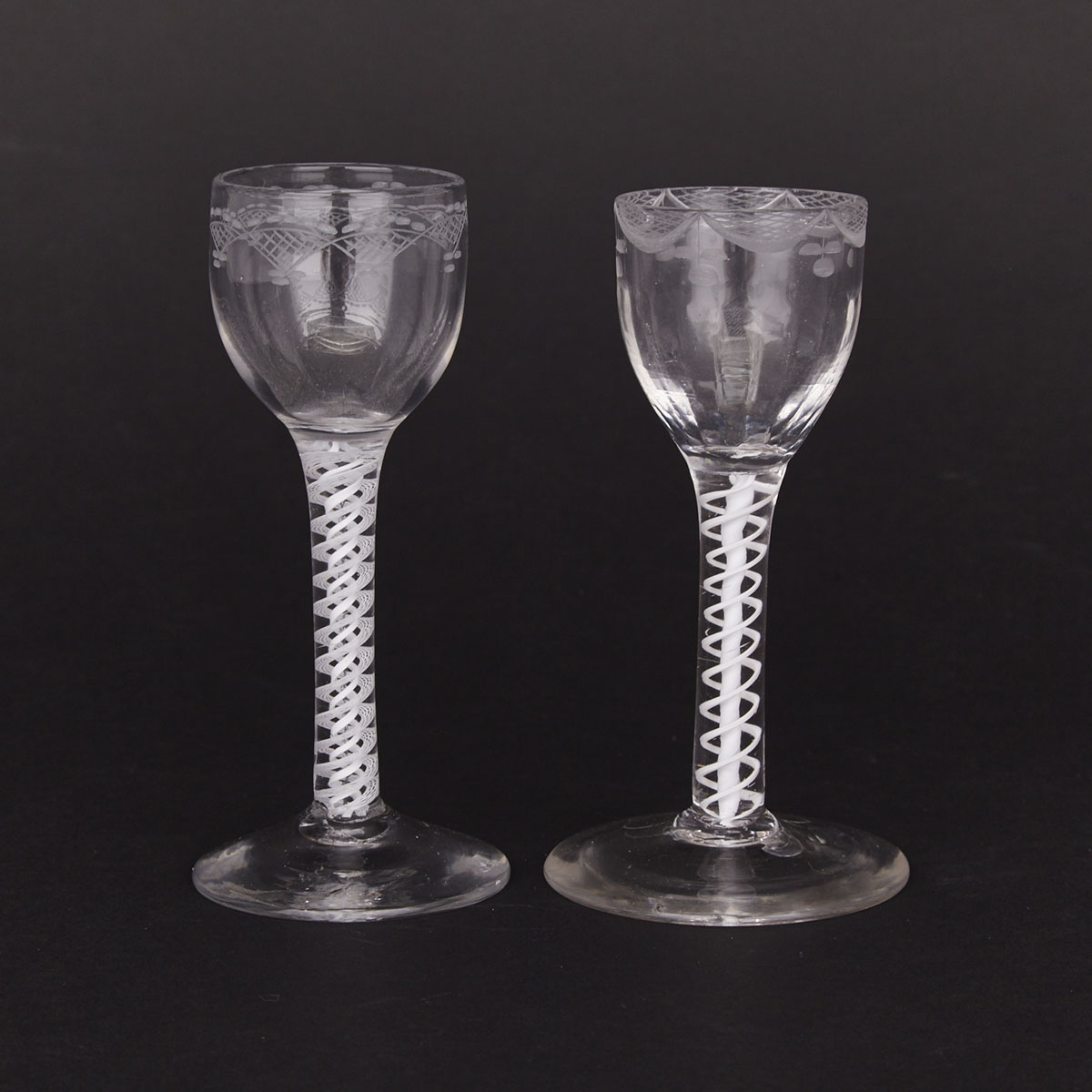 Two English Opaque Twist Engraved Wine Glasses, 18th century