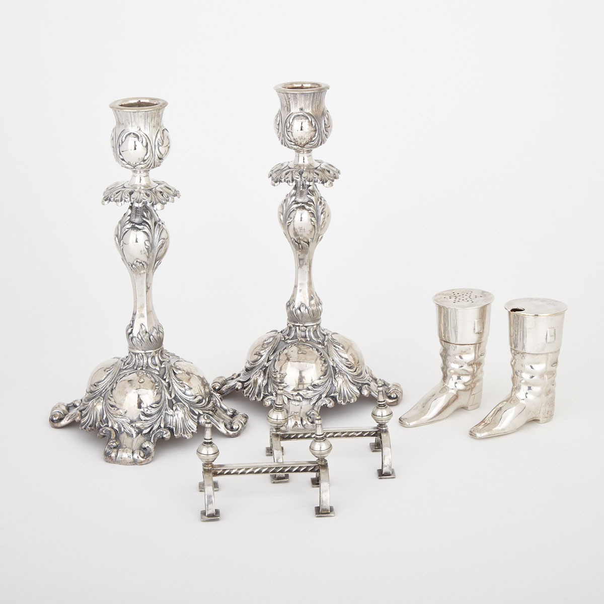 Pair of Silver Plated Candlesticks, Pair of Knife Rests and a Pair of Boot Form Condiments, late 19th century