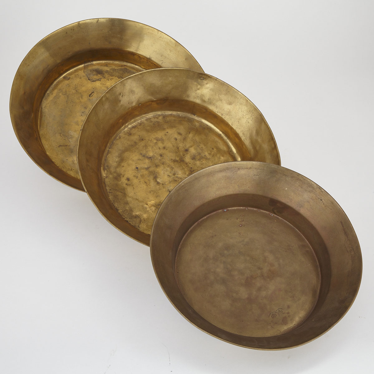 Set of Three Russian Graduated Brass Milk Pans, 19th century