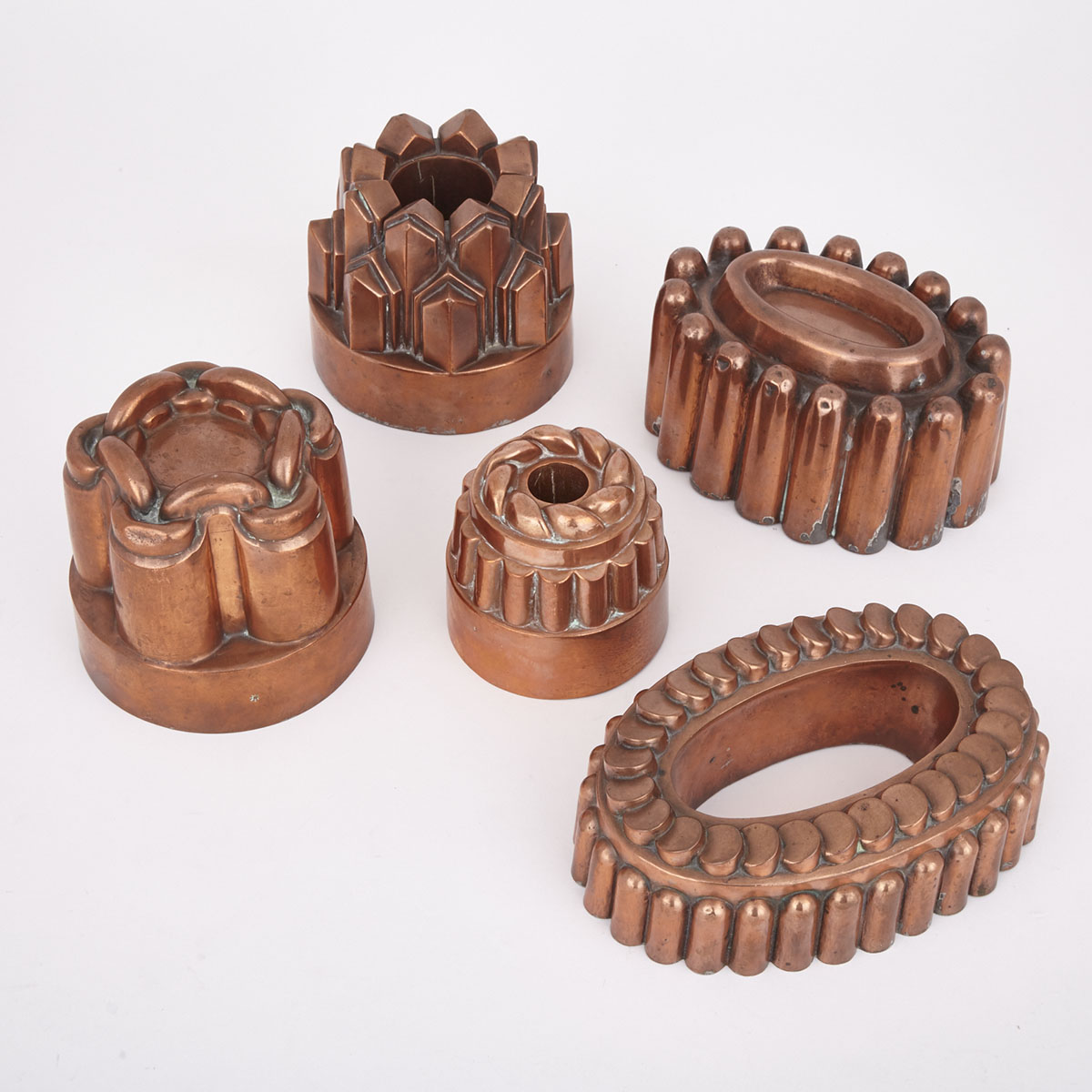 Collection of FIve English Copper Jelly Moulds, early 19th century