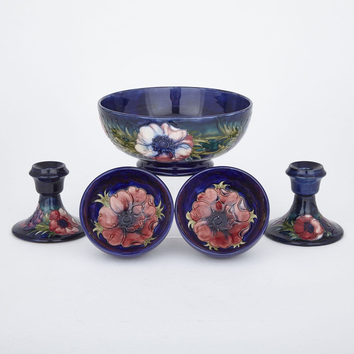 Three Moorcroft Anemone Bowls and a Pair of Low Candlesticks, 1970s