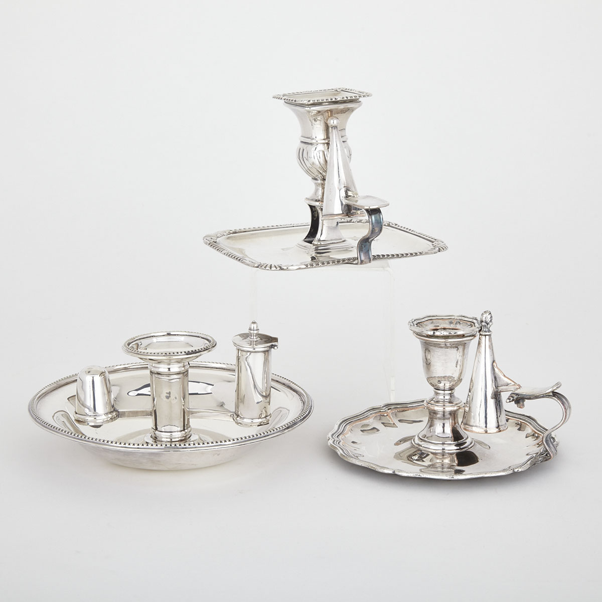 Three Old Sheffield and Edwardian Silver Plated  Chambersticks, 19th/20th century
