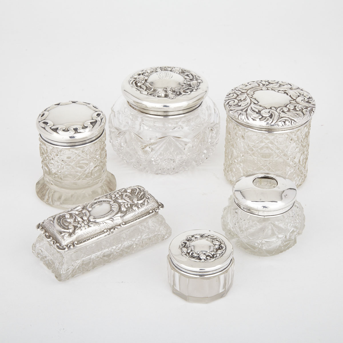 Six English and North American Silver Mounted Cut Glass Dressing Table Jars, late 19th/early 20th century