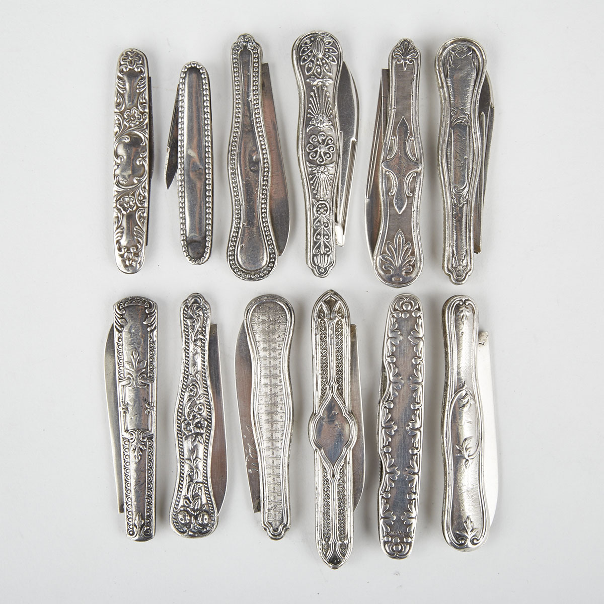 Twelve Mainly American Silver Pocket Knives, late 19th century