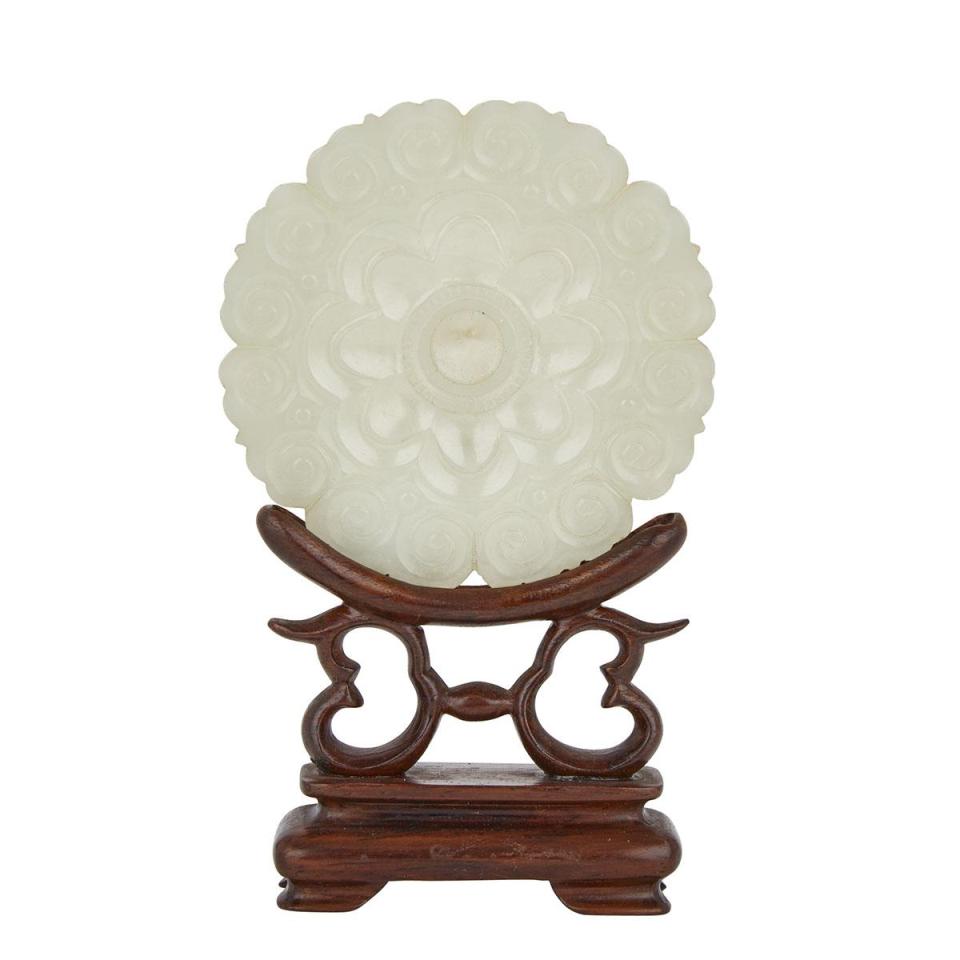 A Celadon White Jade Floral Pendant with a Rosewood Stand, Qing Dynasty, 18th Century 