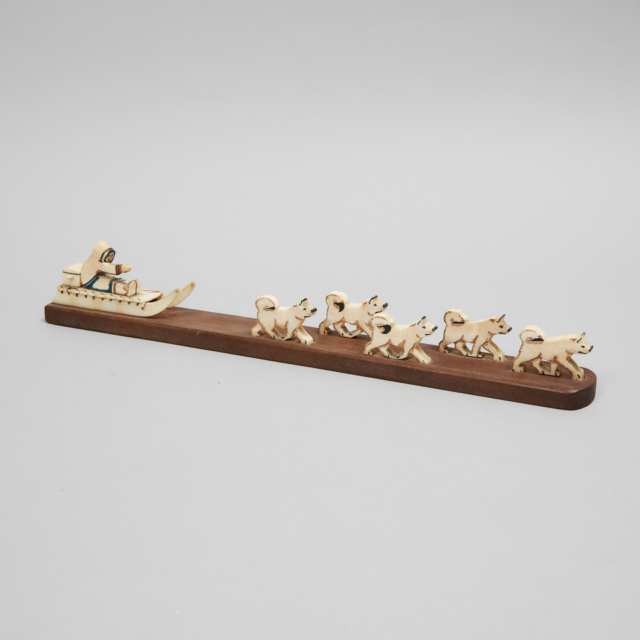 Grenfell Labrador Industries Marine Ivory and Wood Model of a Dog Sled and Team, mid 20th century