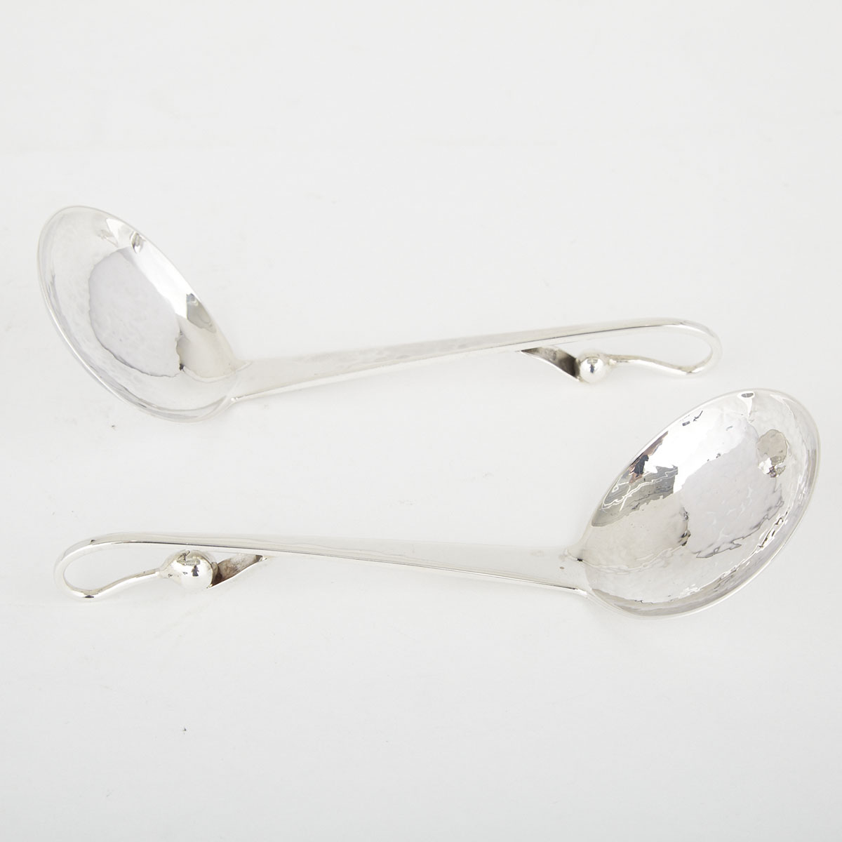 Pair of Canadian Silver Sauce Ladles, Carl Poul Petersen, Montreal, Que., mid-20th century