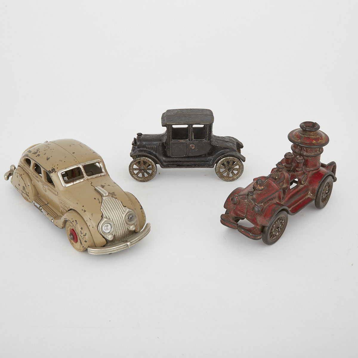 Three American Painted Cast Iron Toy Vehicles, early 20th century