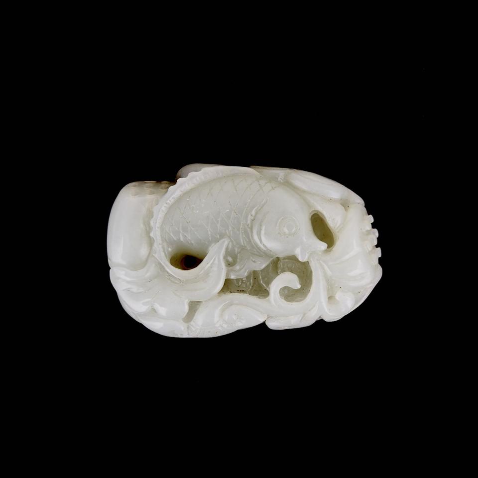 A Celadon White Jade Carving of a Fish and Lotus 