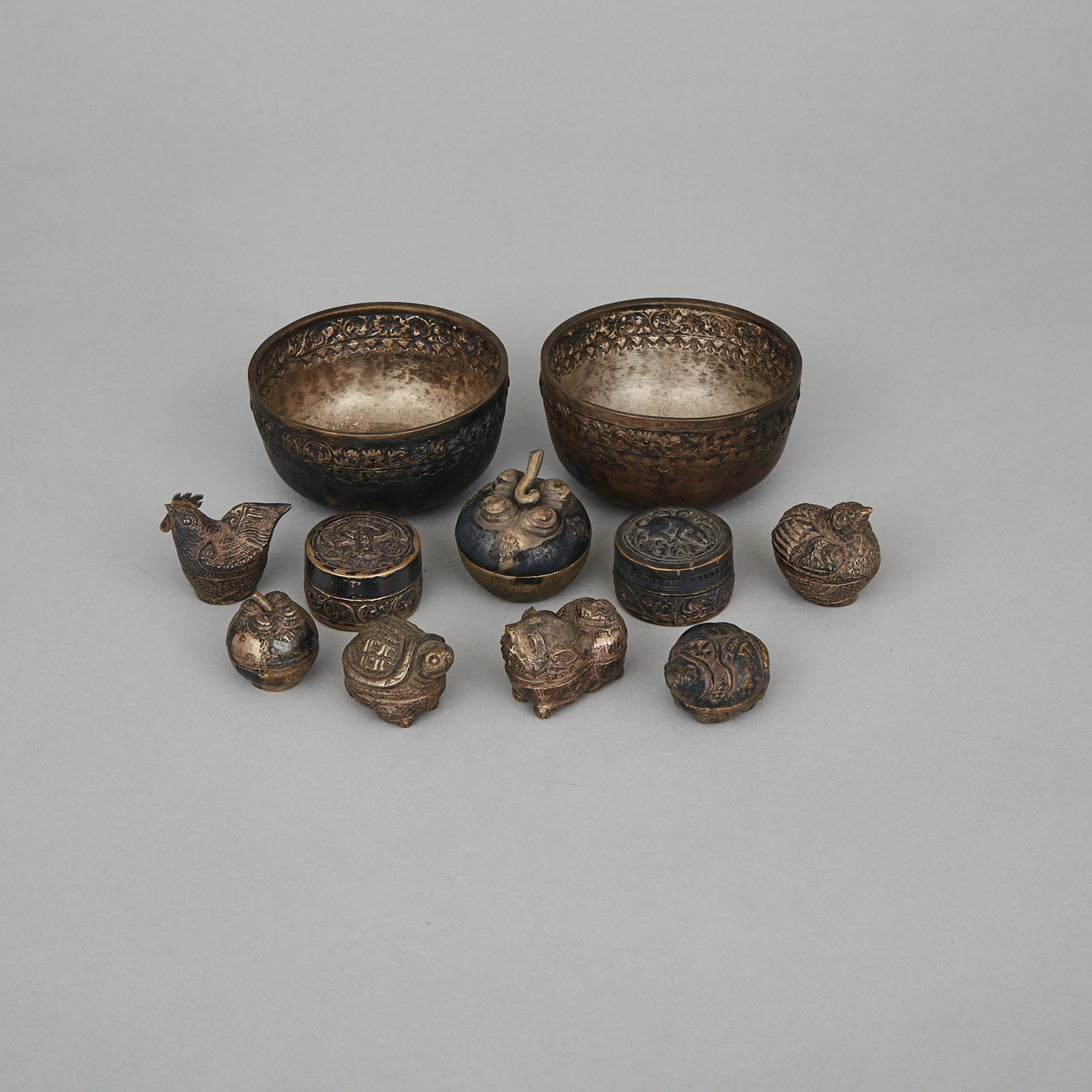 A Group of Eleven Cambodian Silver Containers