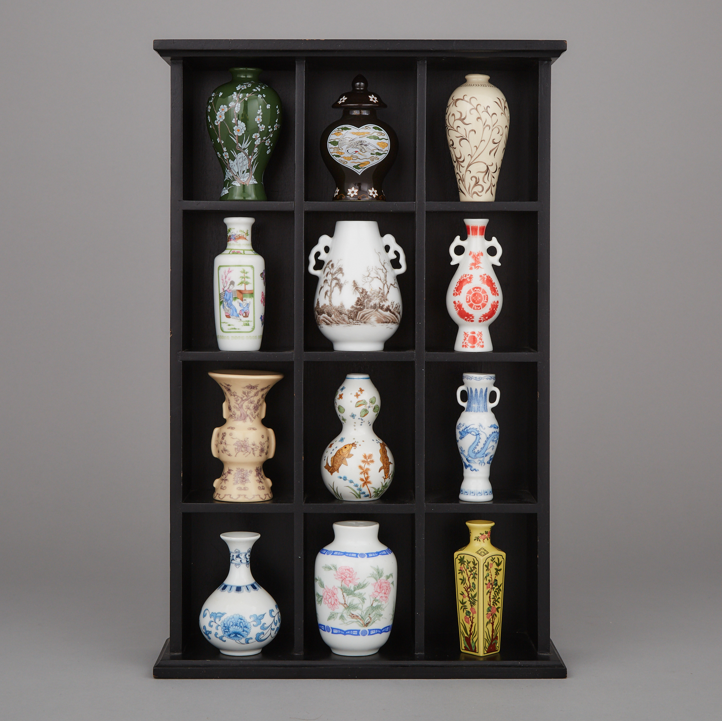 A Set of Twelve Miniature Japanese Porcelain Vases