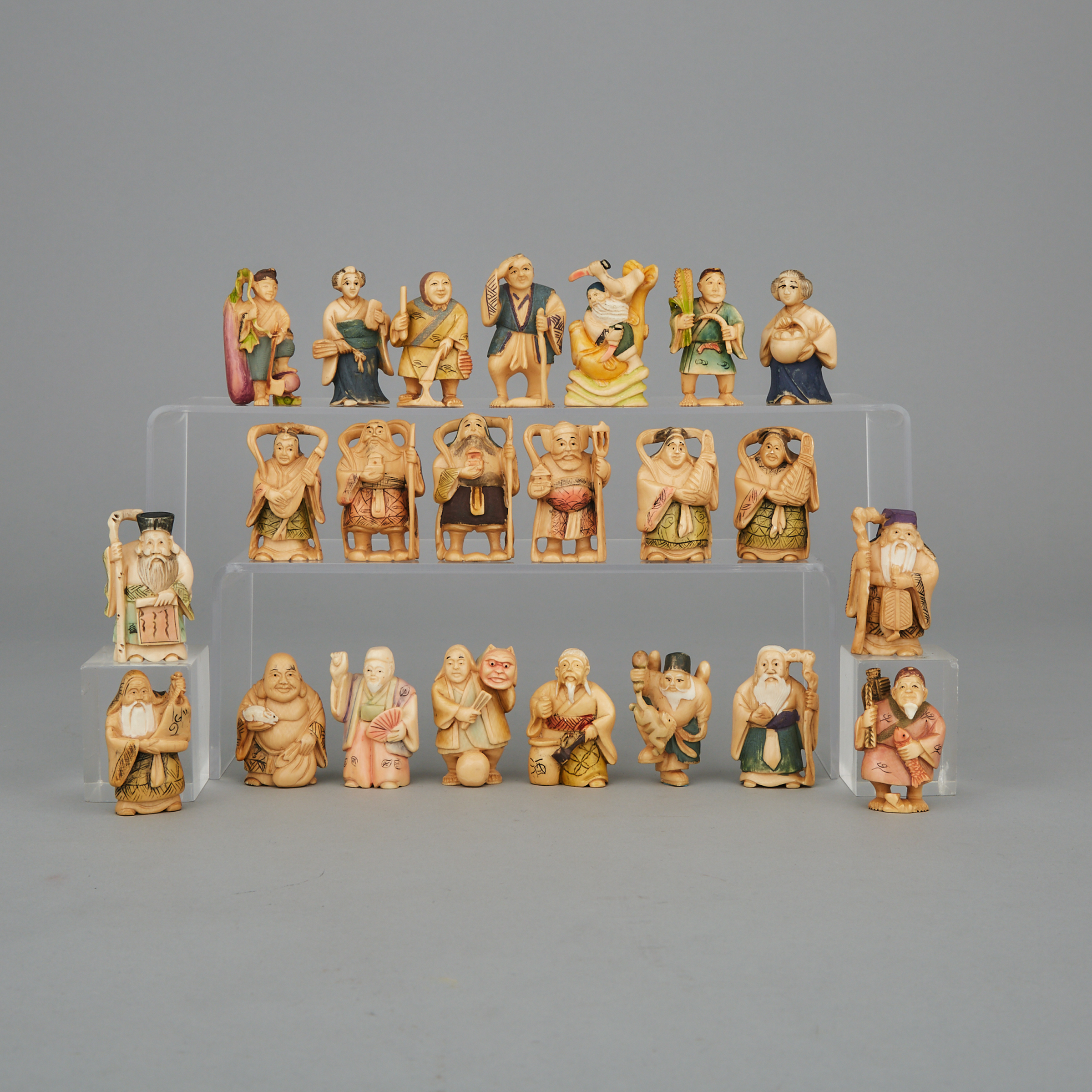 A Group of Twenty-Three Polychrome Ivory Figures, Circa 1940