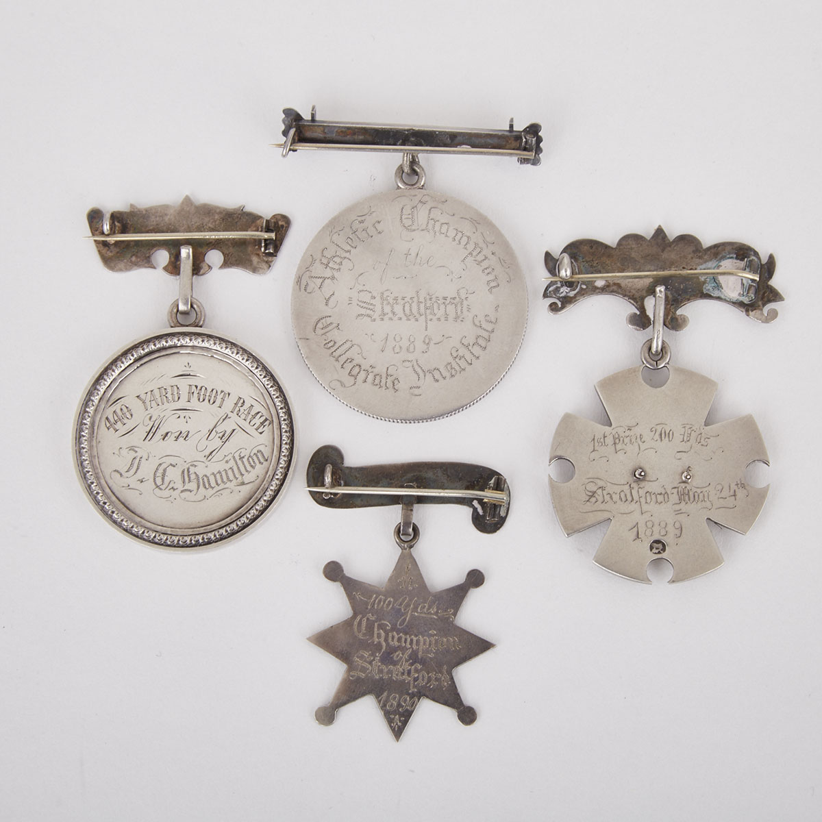 Four Canadian Silver Athletic Medals to John Cecil Hamilton, Stratford Collegiate Institute, Stratford, Ontario, 1889/90