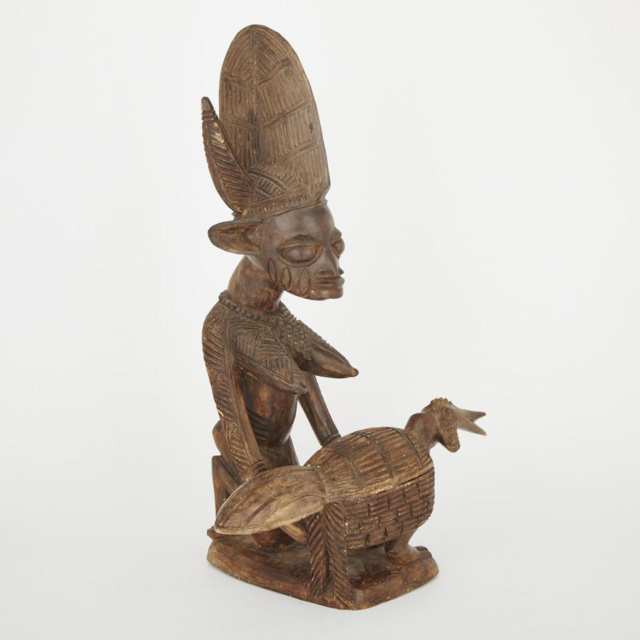 Yoruba Female Figure Holding a Chicken Form Lidded Vessel, West Africa