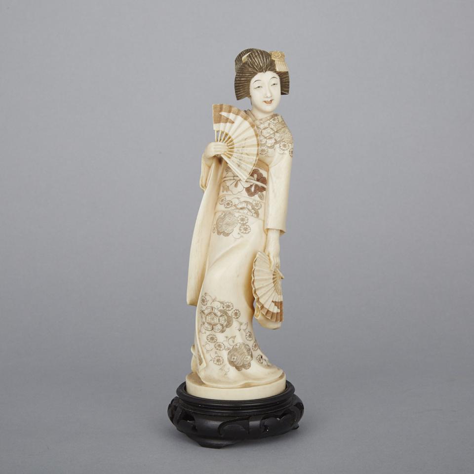 An Ivory Okimono of a Geisha, Early 20th Century