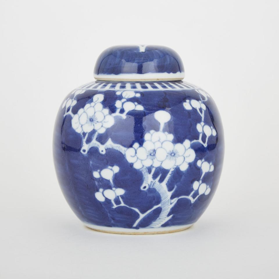 A Blue and White Covered Ginger Jar