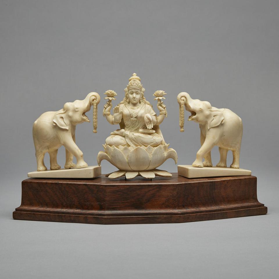 An Indian Ivory Carved Trio of Lakshmi and Elephants, Early 20th Century