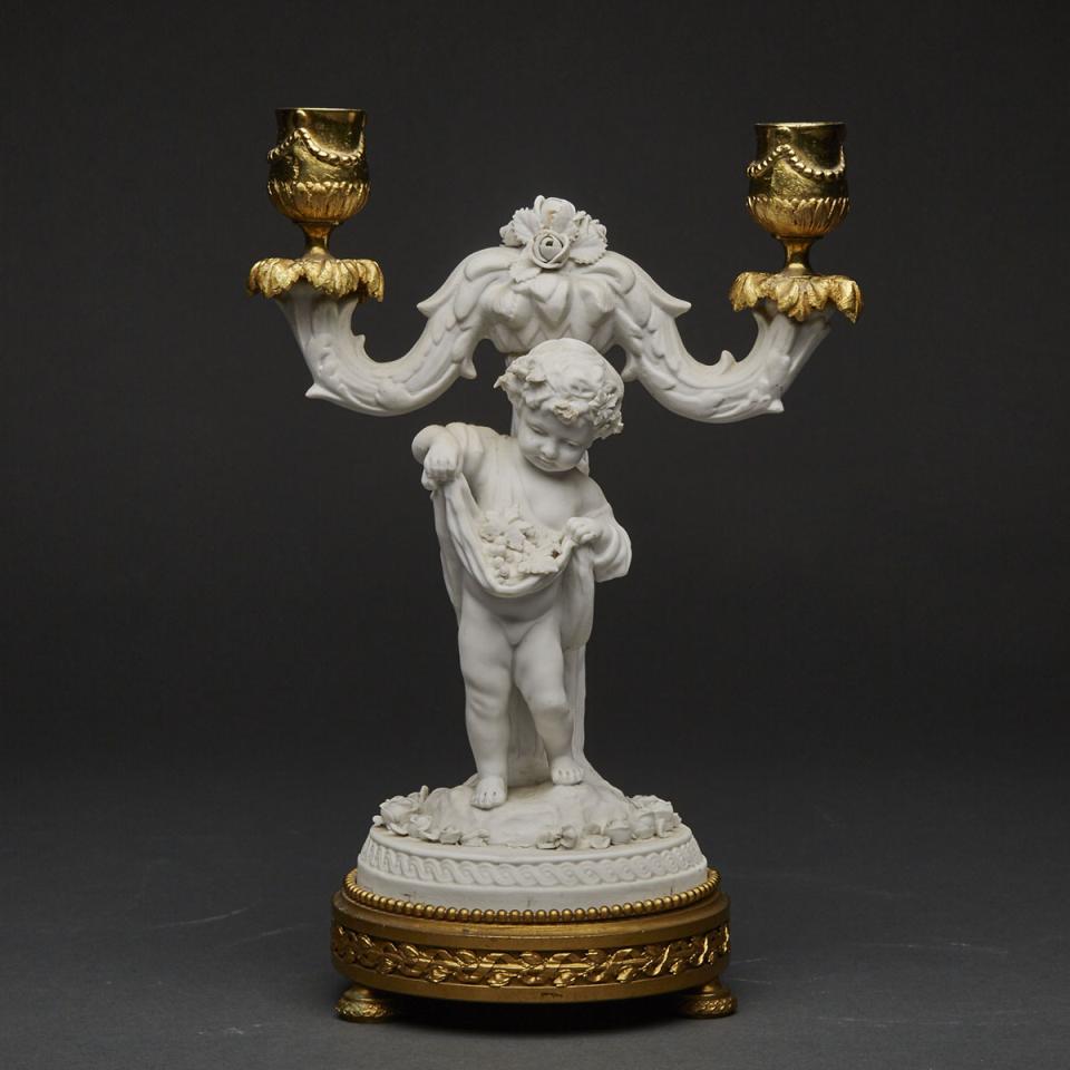 French Ormolu Mounted White Biscuit Two-Light Candelabra with Bacchus Child Figure, 19th century 