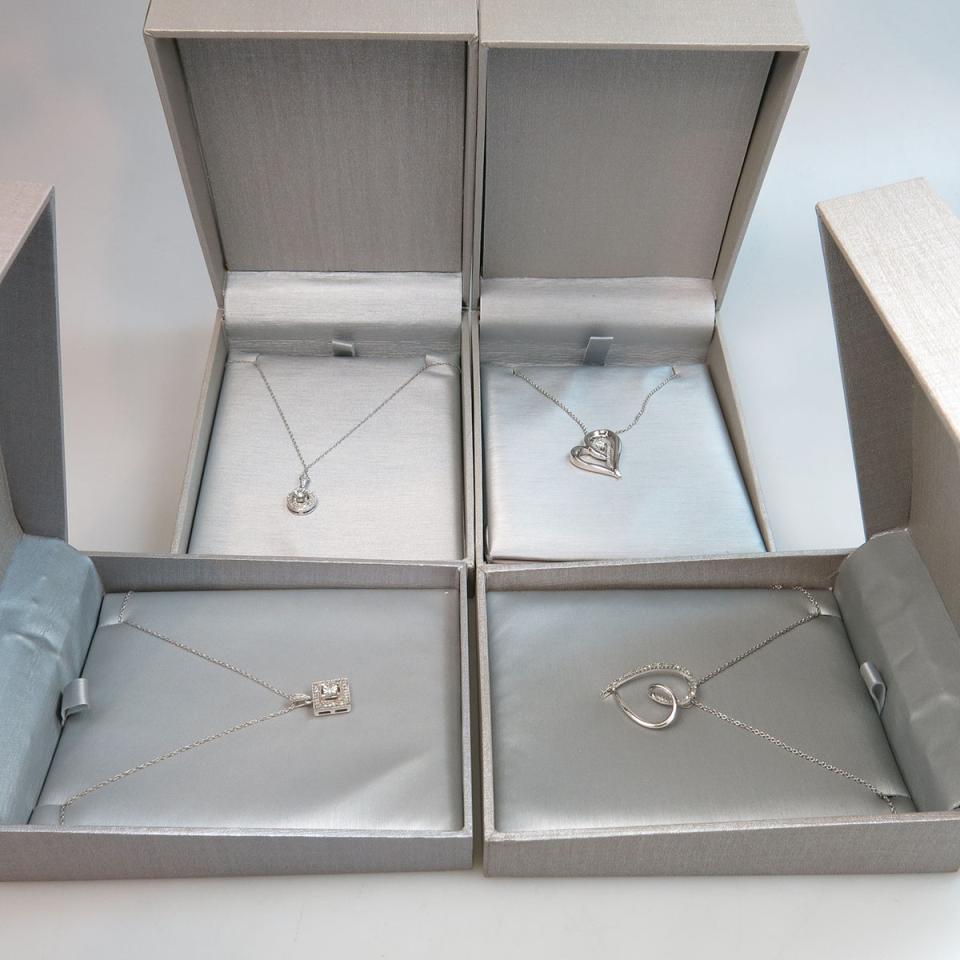 Four Sterling Silver Pendants And Chains