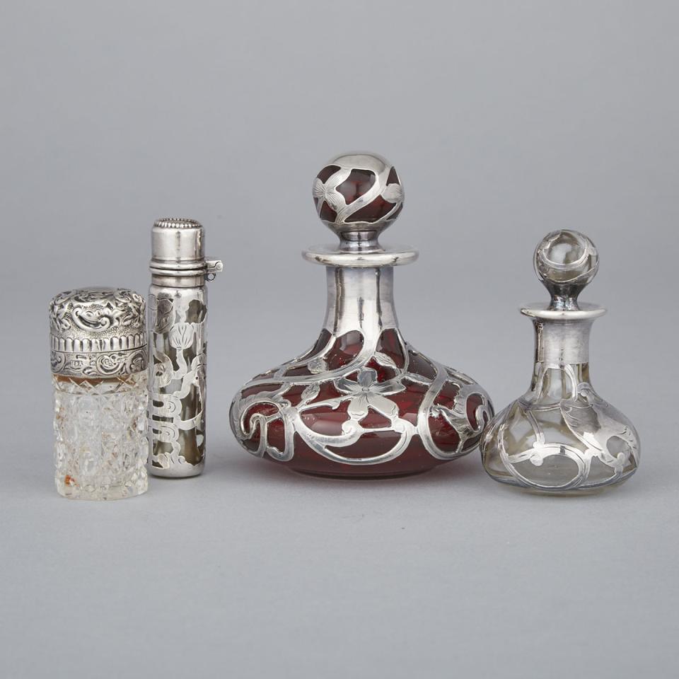 Four Victorian and North American Silver Mounted and Overlaid Glass Perfume Bottles, late 19th/early 20th century