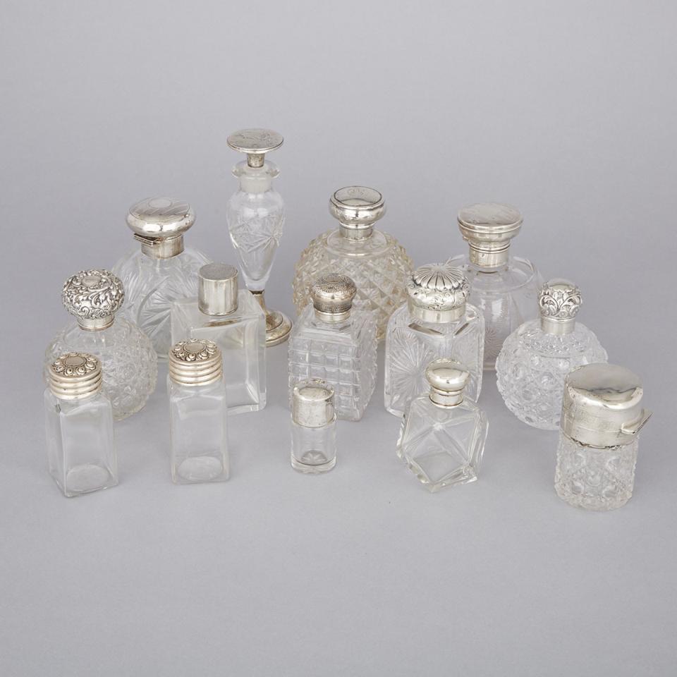 Fourteen English and North American Silver Mounted Glass Perfume and Toilet Water Bottles, late 19th/20th century