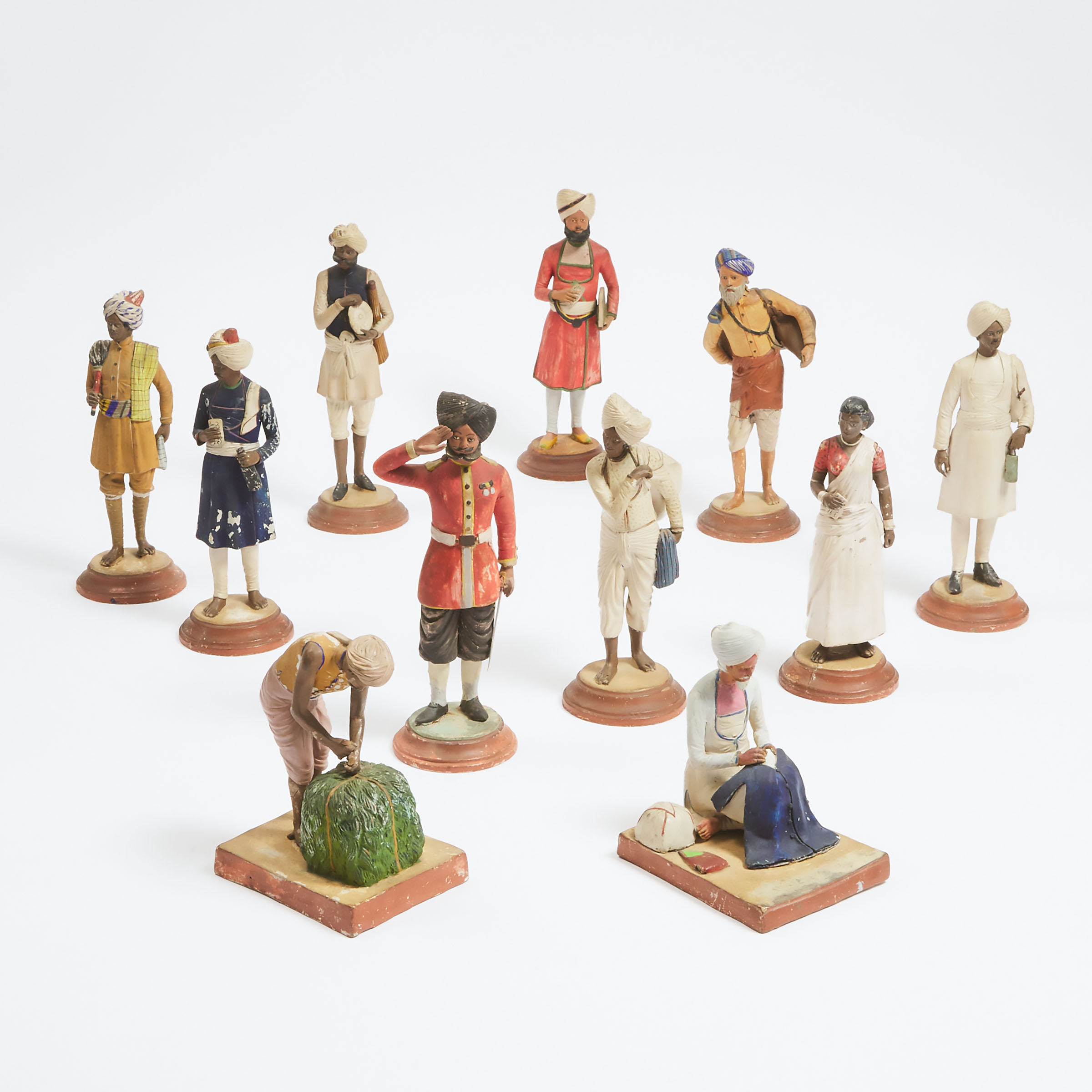 Group of Eleven East India Company School Painted Terracotta Figures, Lucknow, India, late 19th century