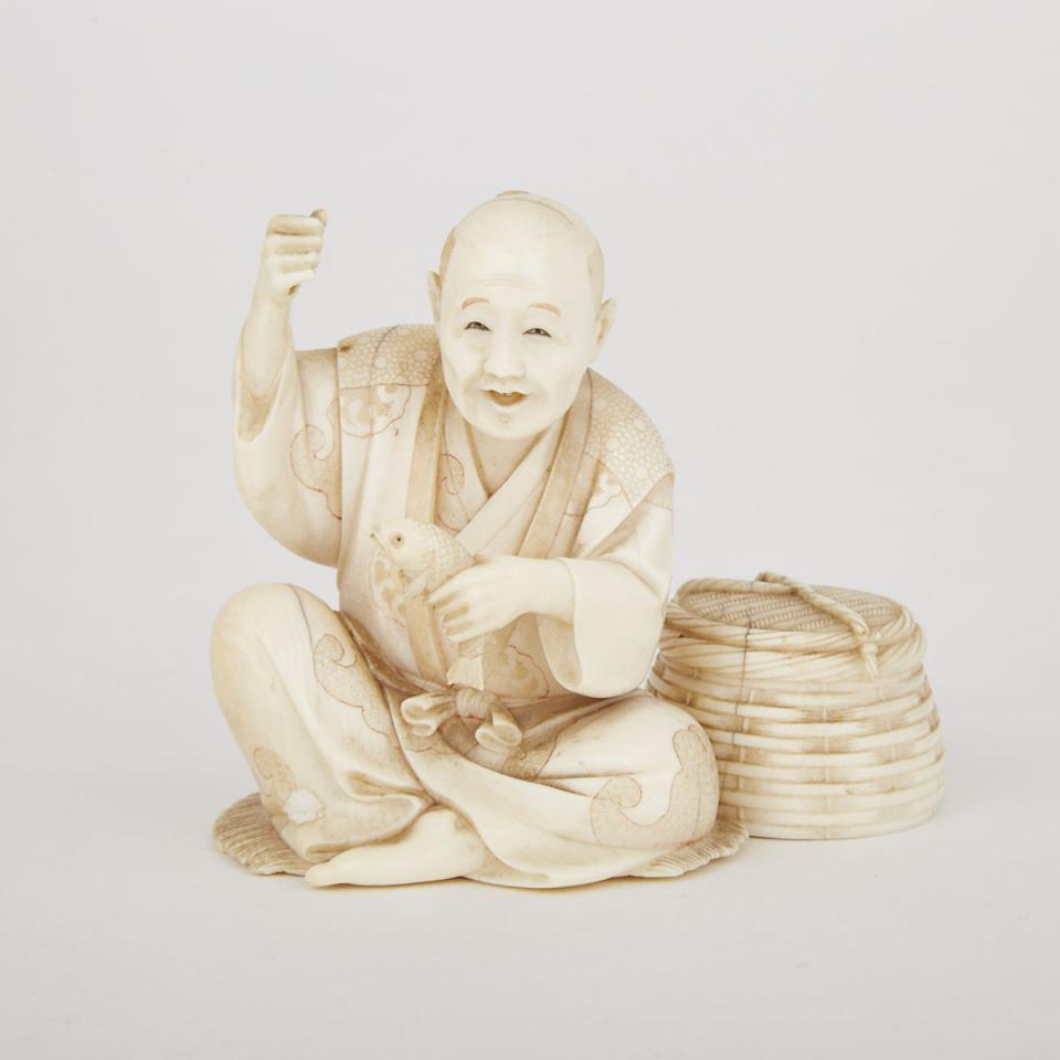 A Japanese Carved Ivory Okimono of A Fisherman, Gyokusui 玉水 Mark 