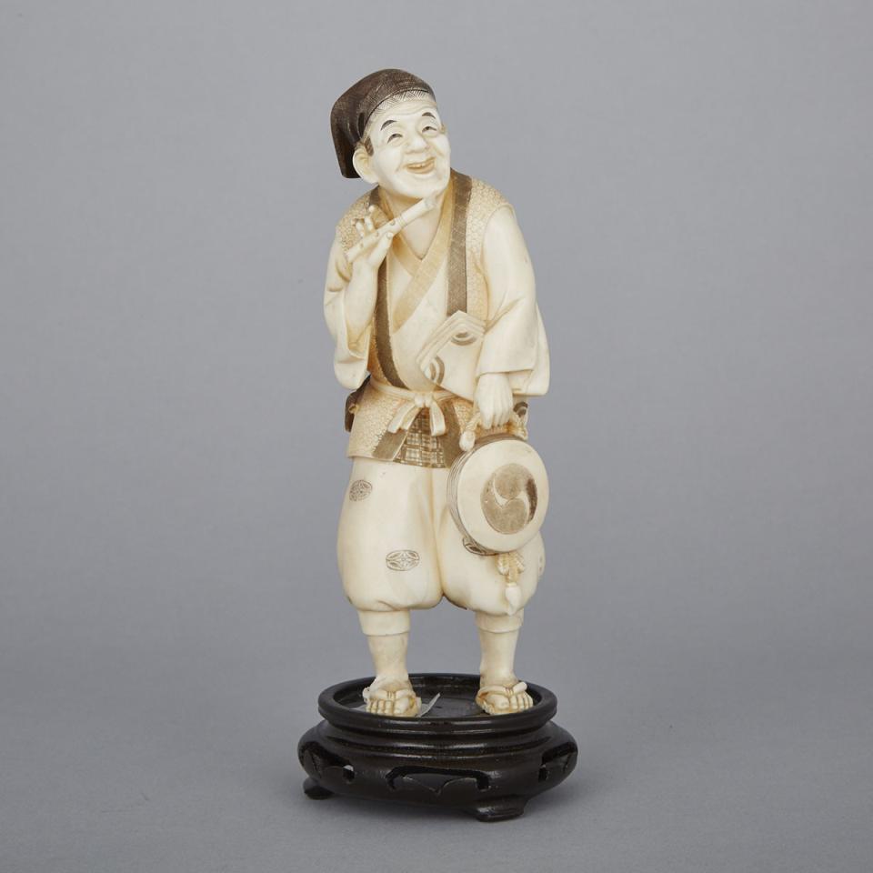 An Ivory Okimono of a Peddler, Early 20th Century