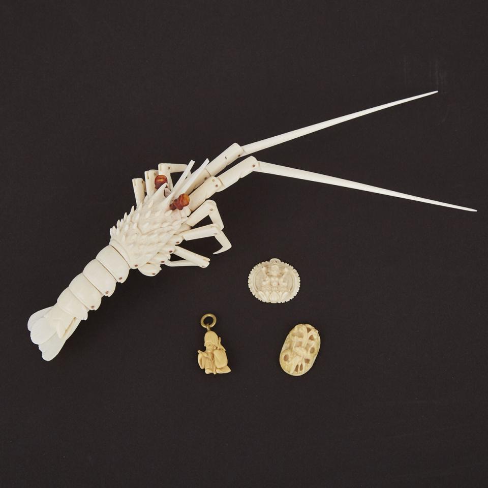 A Carved Ivory Articulated Jizai Okimono of a Crayfish together with Three Carved Ivory Pendants, Early 20th Century 
