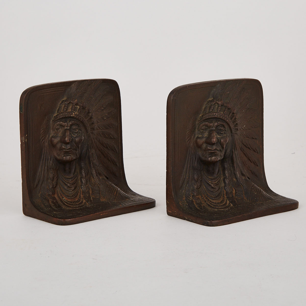 Pair of American Coppered Cast Iron ‘Indian Portrait’ Relief Bookends, c.1900