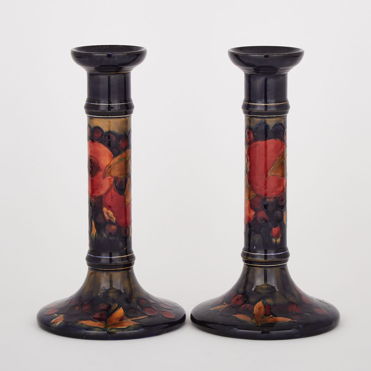 Pair of Moorcroft Pomegranate Table Candlesticks, c.1925
