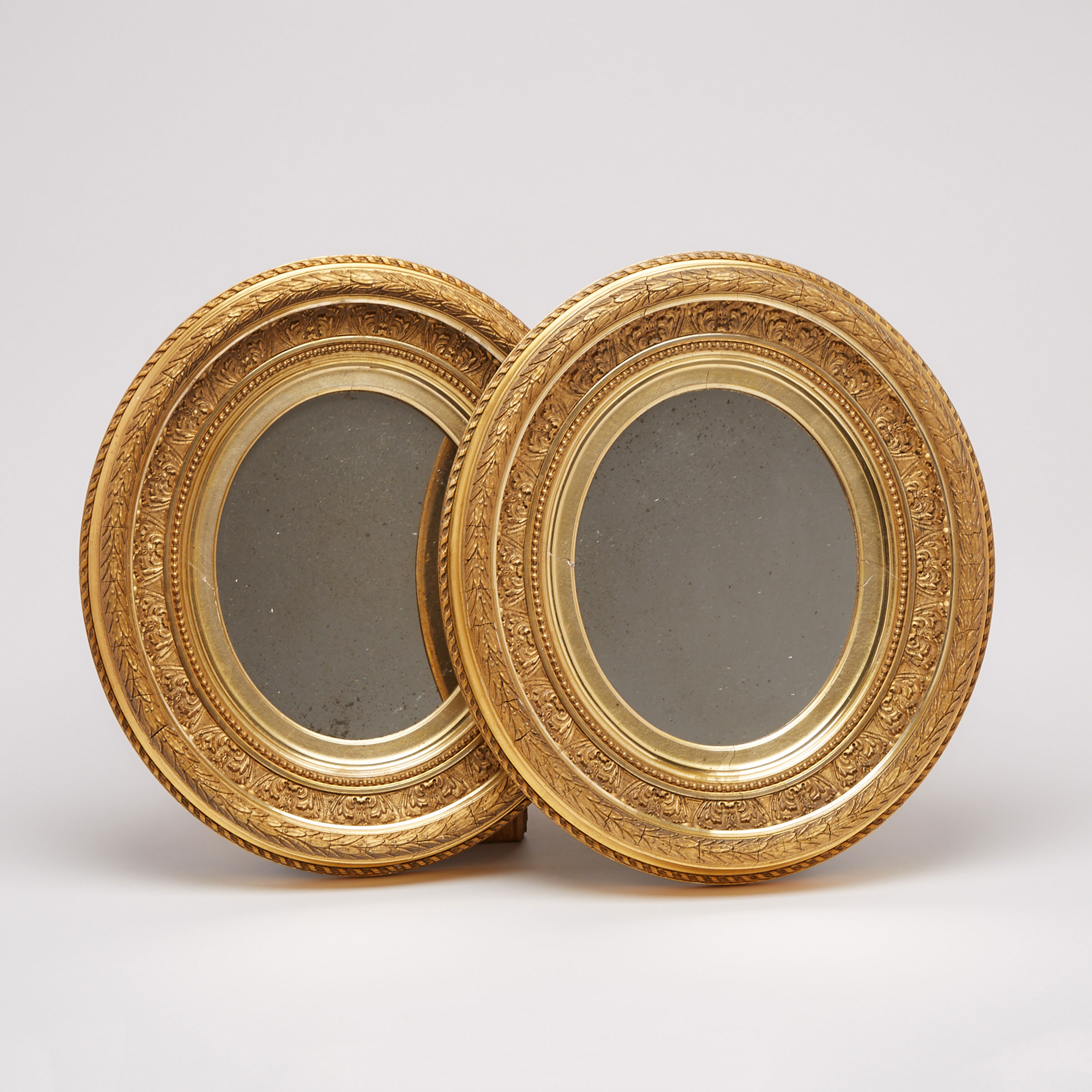 Pair of French Neoclassical Oval GIlt Gesso Girandol Mirrors, 19th century