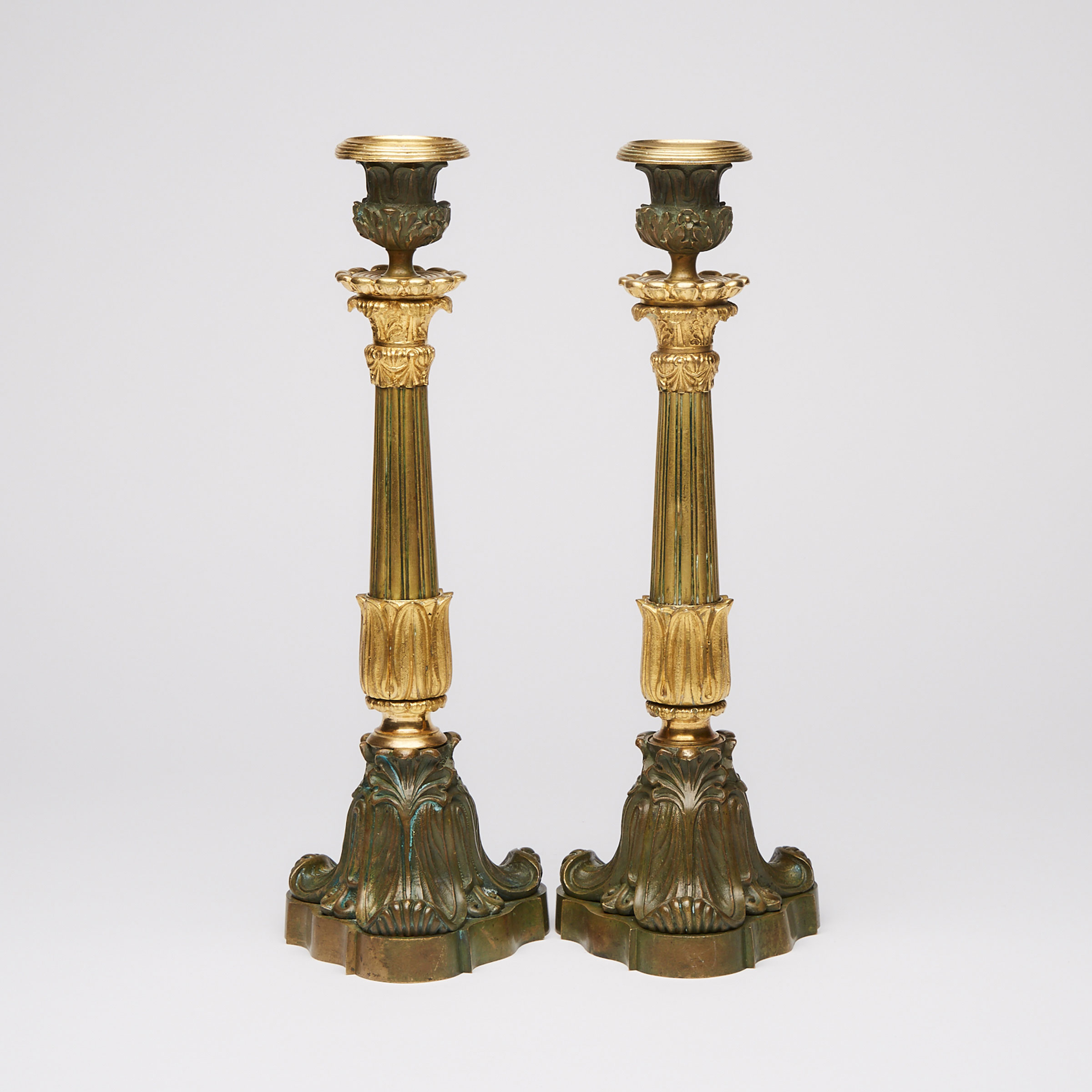 Pair of French Empire Gilt and Patinated Bronze Candlesticks, mid 19th century