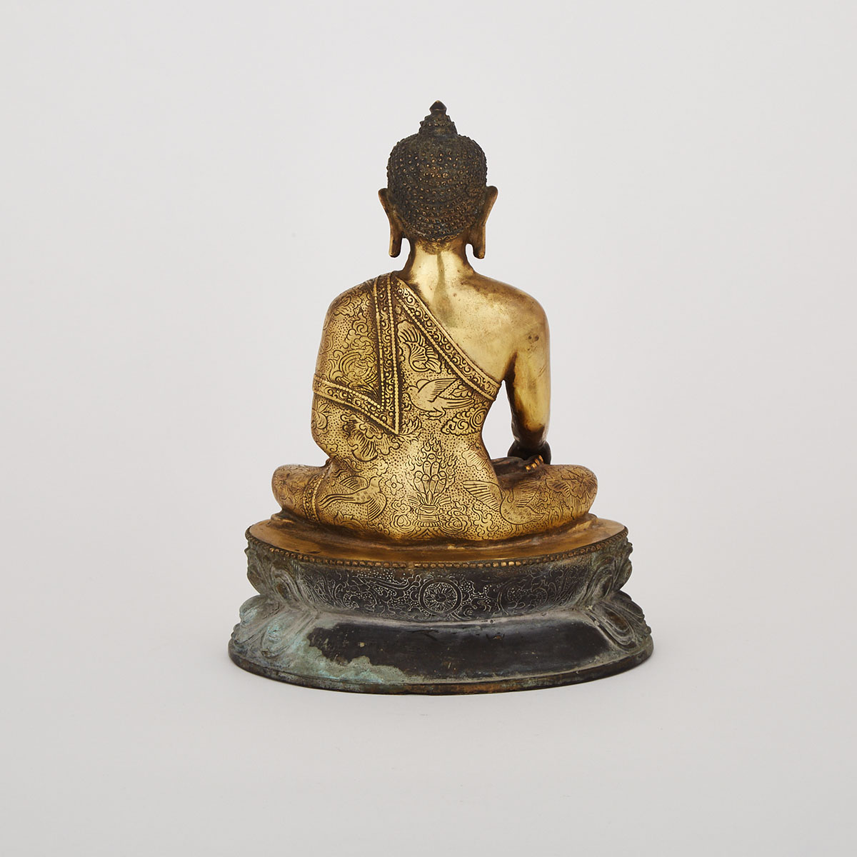 A Tibetan Bronze Seated Medicine Buddha