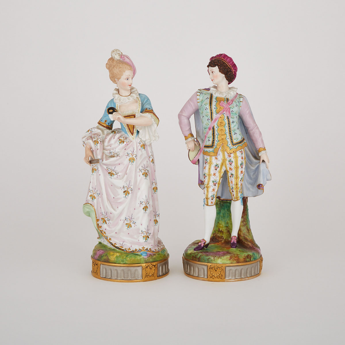 Pair of French Porcelain Figures of a Lady and Musician, late 19th century