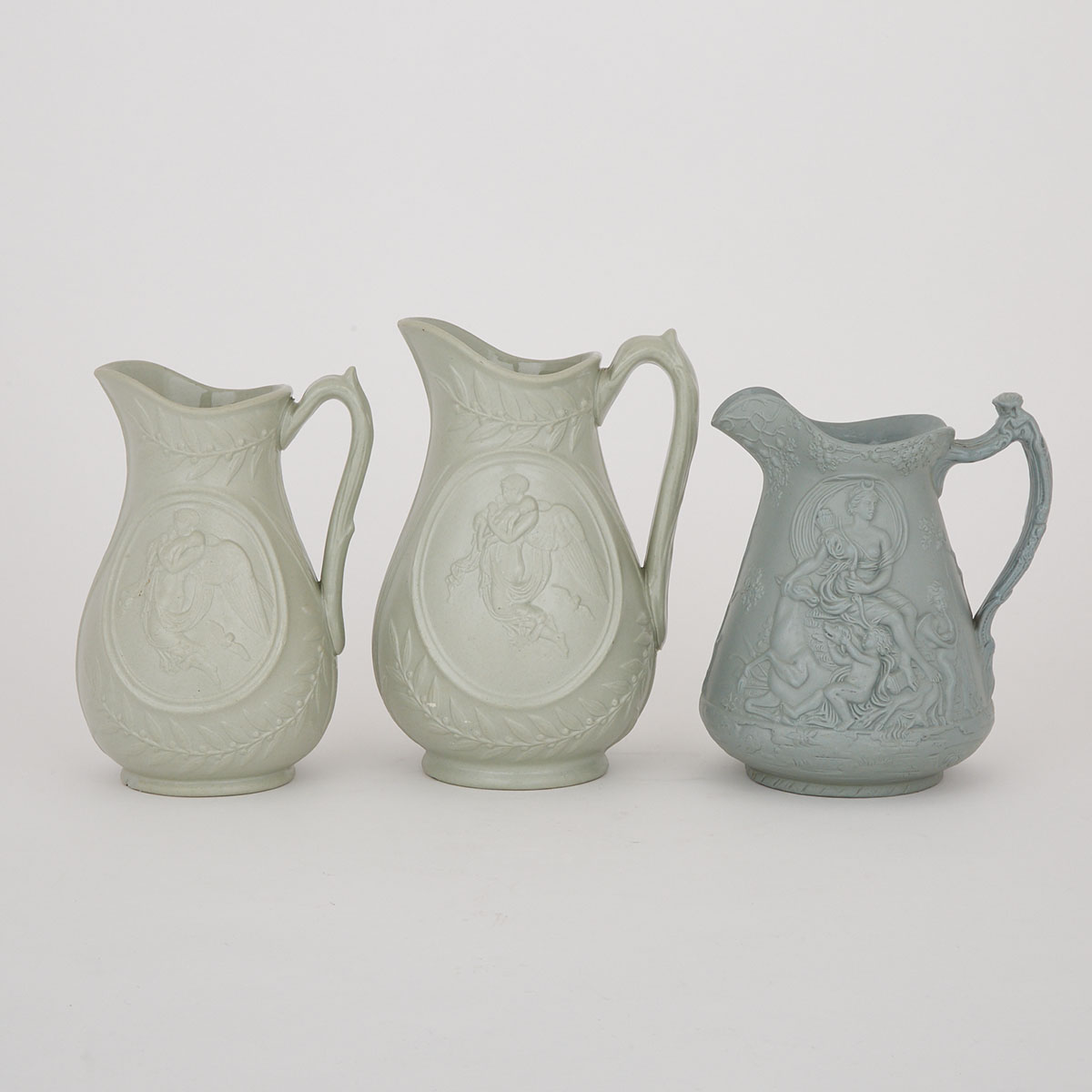 Three English Moulded Stoneware Jugs, late 19th century