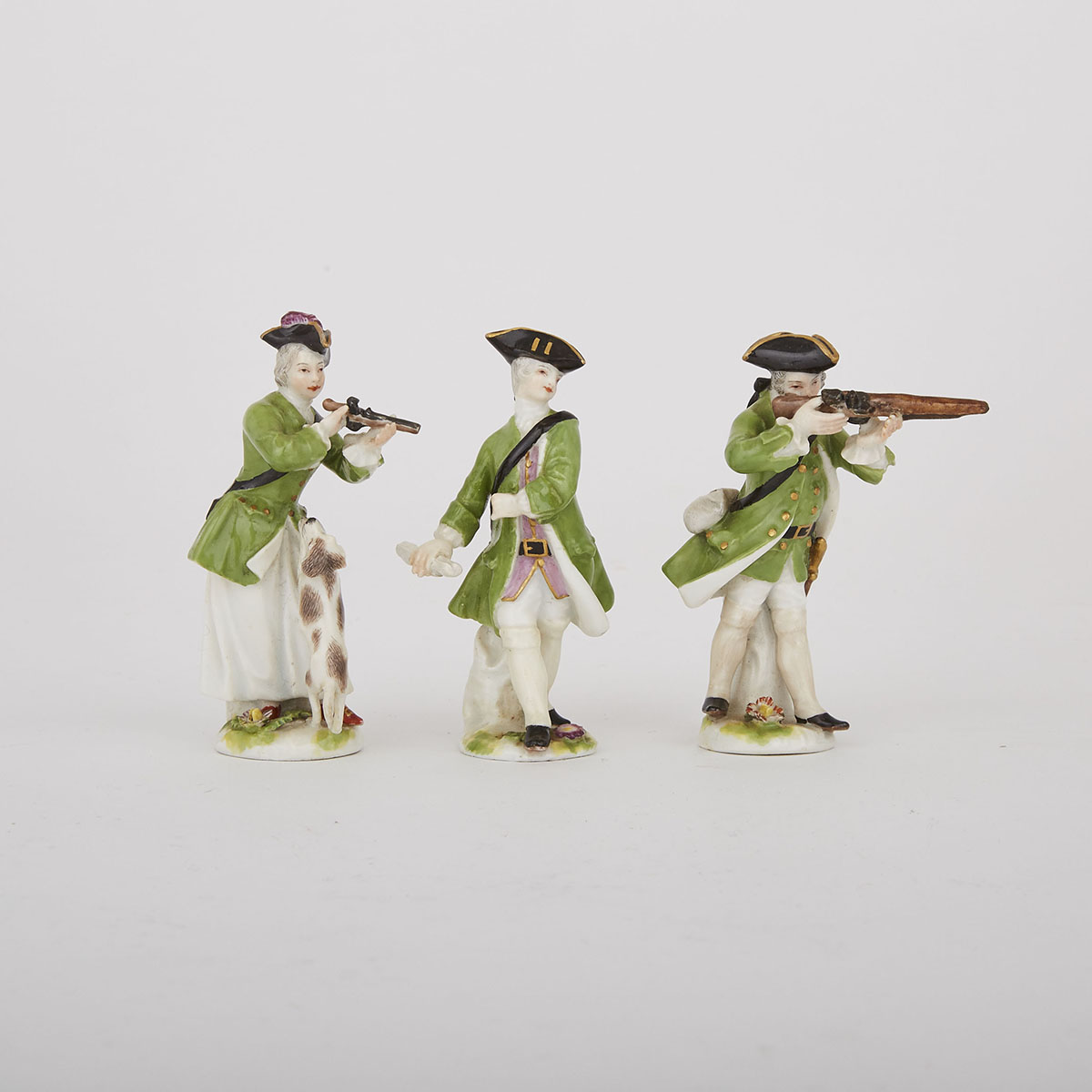 Three Meissen Miniature Figures of a Huntsman, Huntress and Messenger,  late 19th/early 20th century