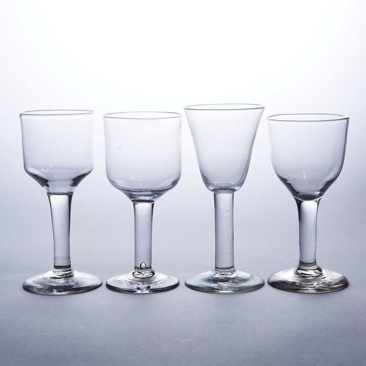 Four English Plain Stemmed Glass Goblets, mid-18th century