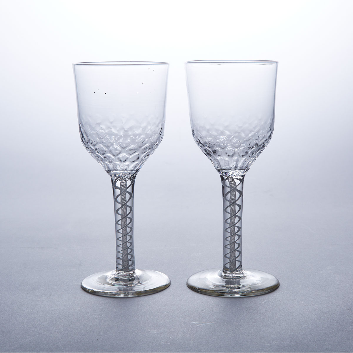 Pair of English Honeycomb Moulded Opaque Twist Stemmed Glass Goblets, c.1760-80