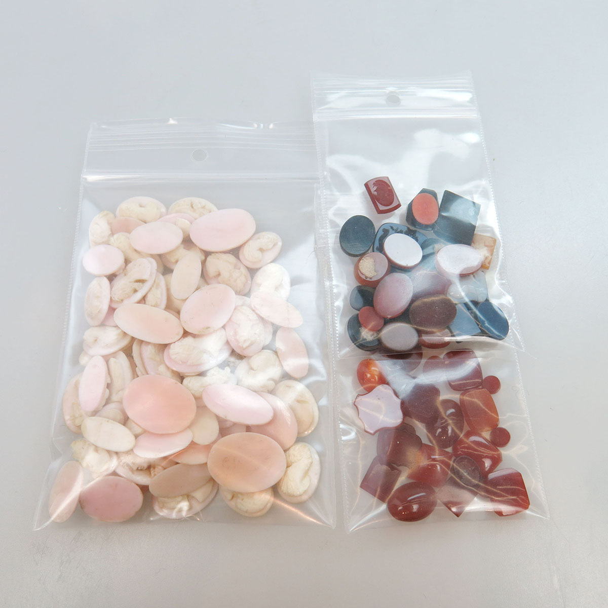 Quantity Of Carved Pink Shell Cameos, Hardstone Cameos, And Carnelian Panels