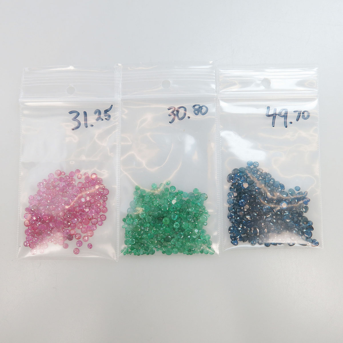 Quantity Of Unmounted Various Cut Emeralds, Sapphires And Rubies