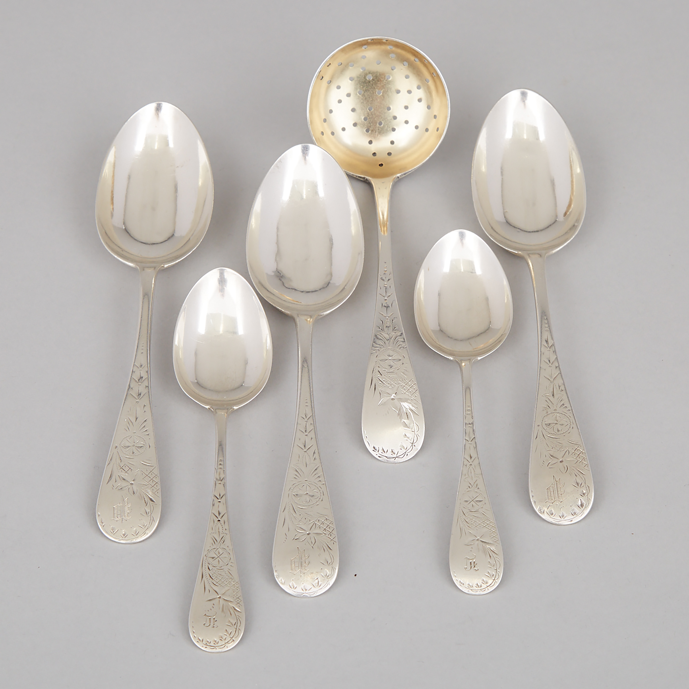 Three Canadian Silver Engraved Old English Pattern Dessert Spoons, Two Tea Spoons and a Sugar Sifter, Hendery & Leslie for Henry Birks & Sons, Montreal, Que., c.1880-97