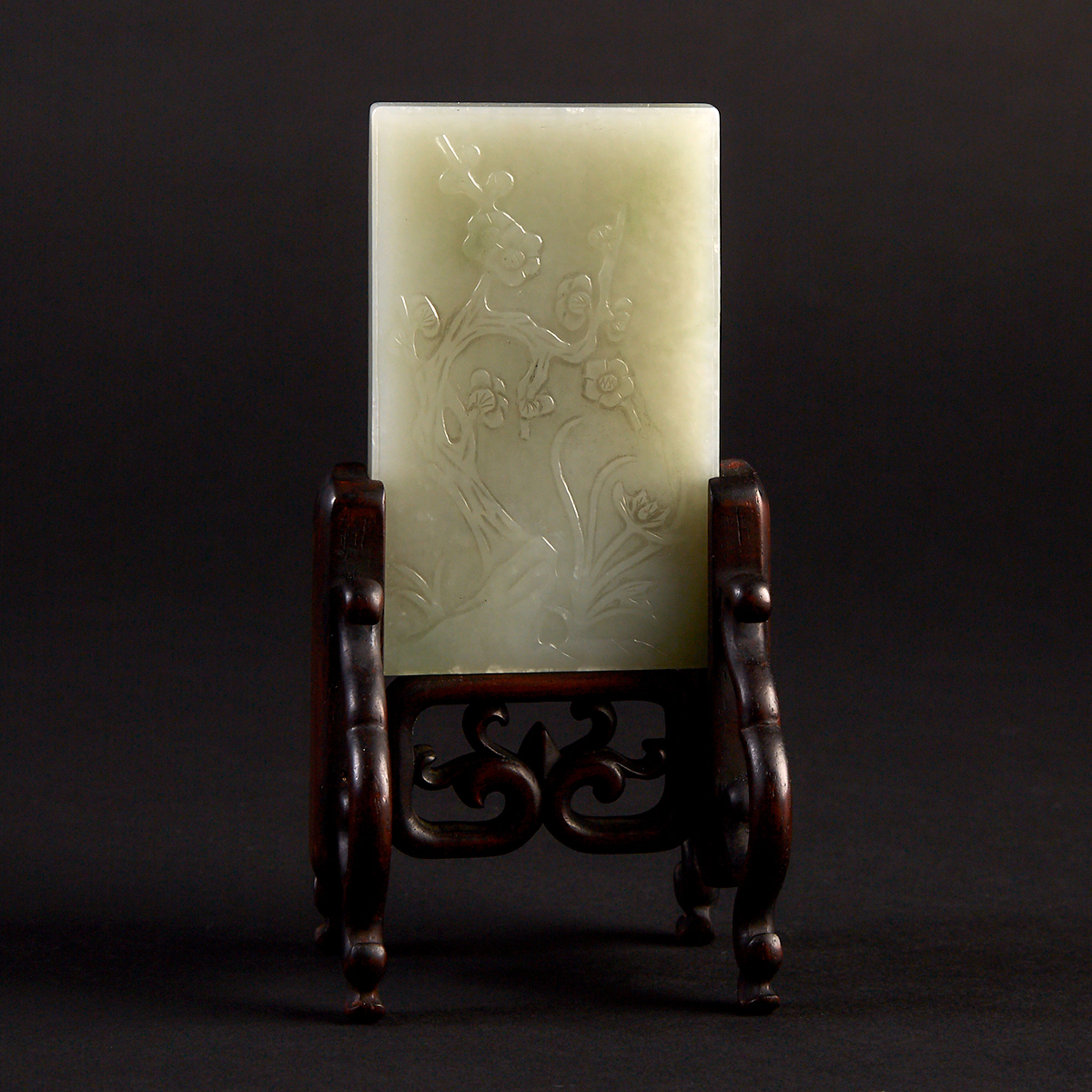 A White Jade Plaque on Stand